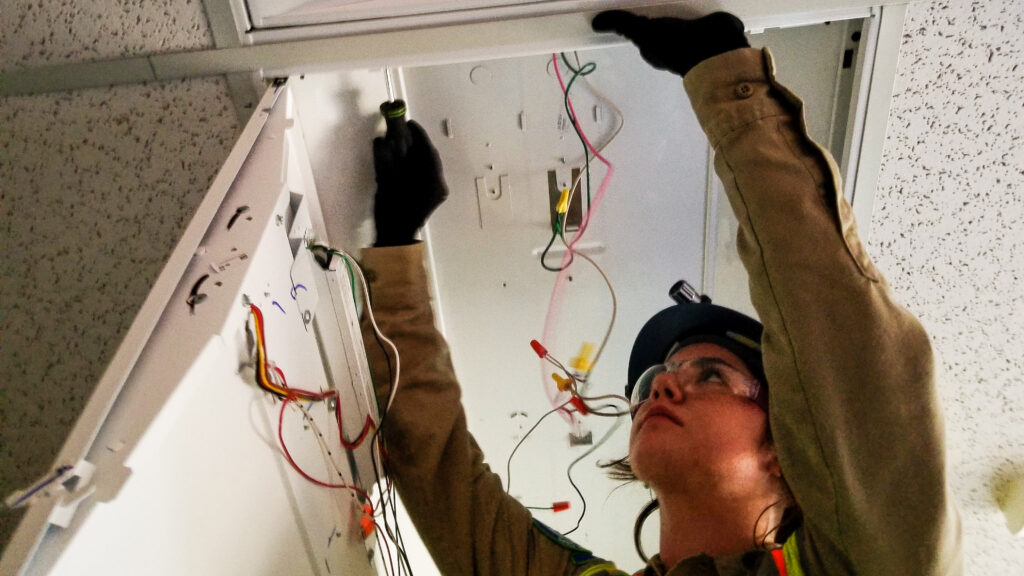 Image Female CM Working on Lighting Fixture