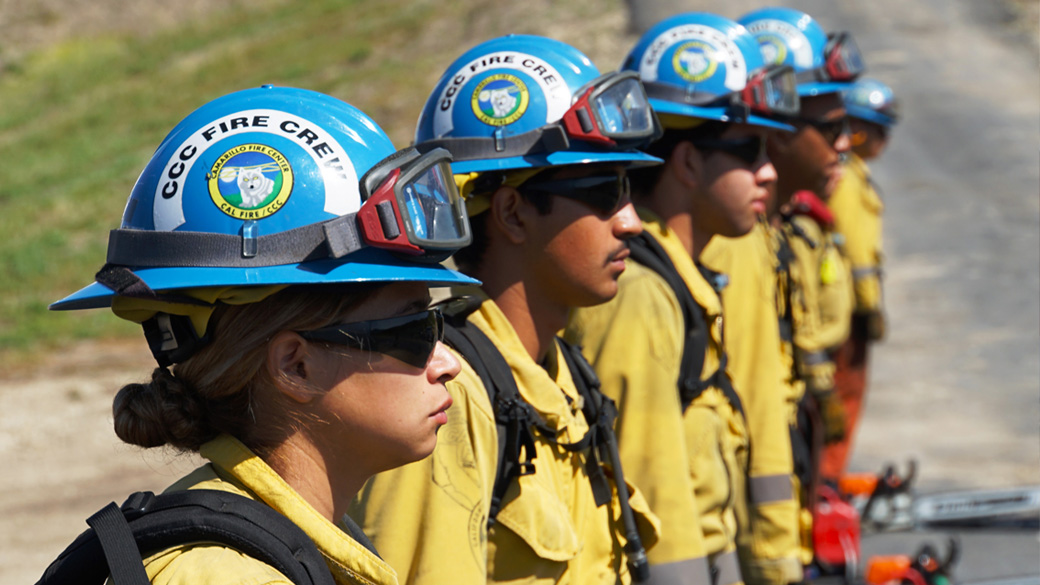 Camarillo Fire Crew Drill 1040 Corpsmembers use a rock bar to move a giant boulder off the trail.