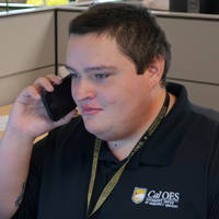 photo of man on the phone at a desk