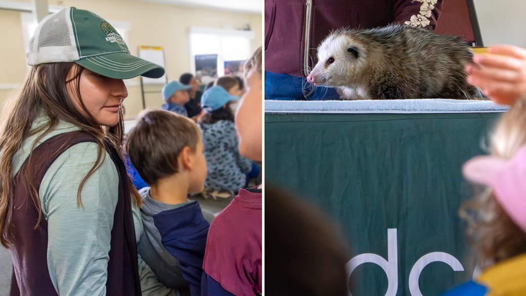 On left, Mia Rangel sits with campers during a presentation that featurd an animal, an opposum viewed on the right.