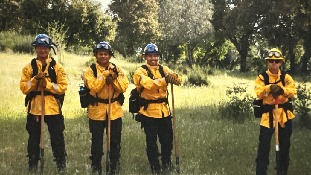 Fire crew Corpsmembers relax in the shade. 
