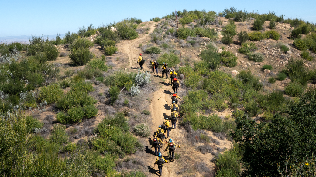 The CCC Toro Fire Crew tackles steep elevation while hiking in the Santa Margarita hills. 